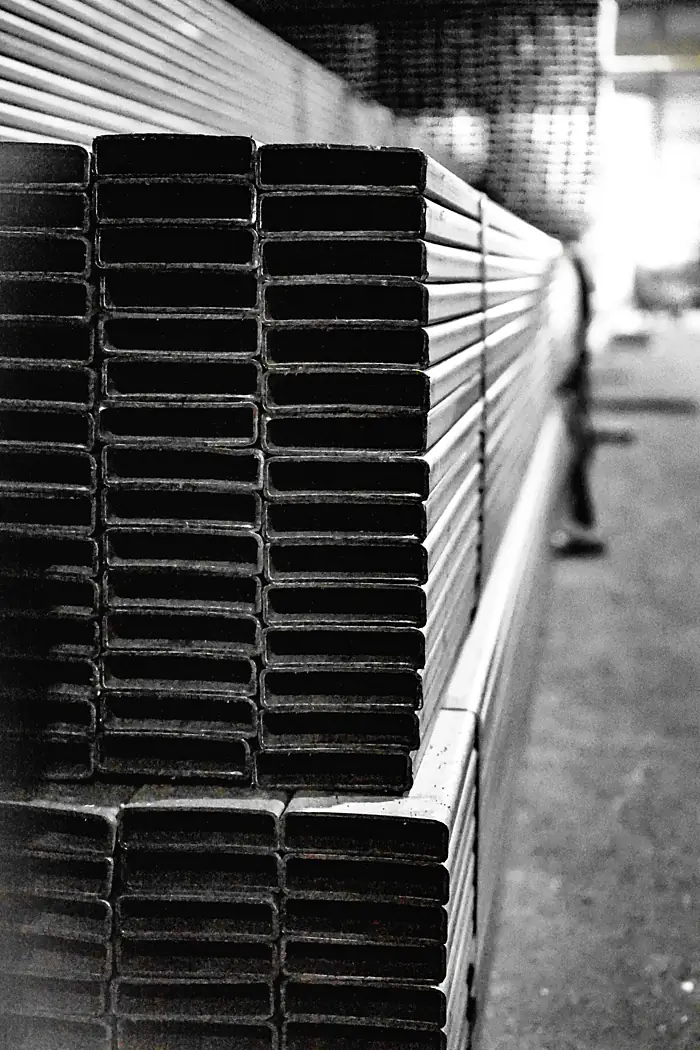 Strapped bundles of flat-sided steel tube ready for despatch