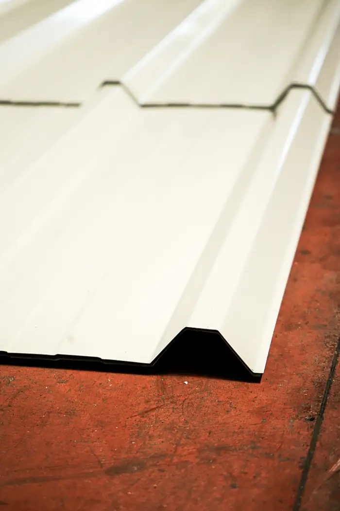 Profiled steel sheet with coated finish